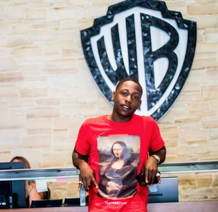  q-money-signs-with-warner-bros